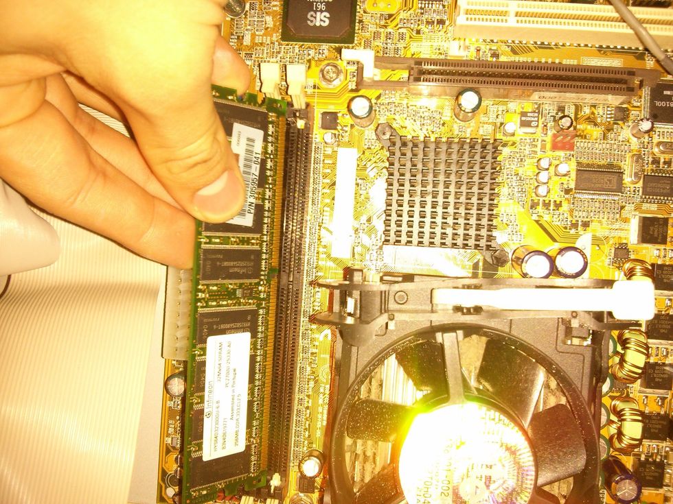 Align the memory stick with the notch and make sure the slot is open