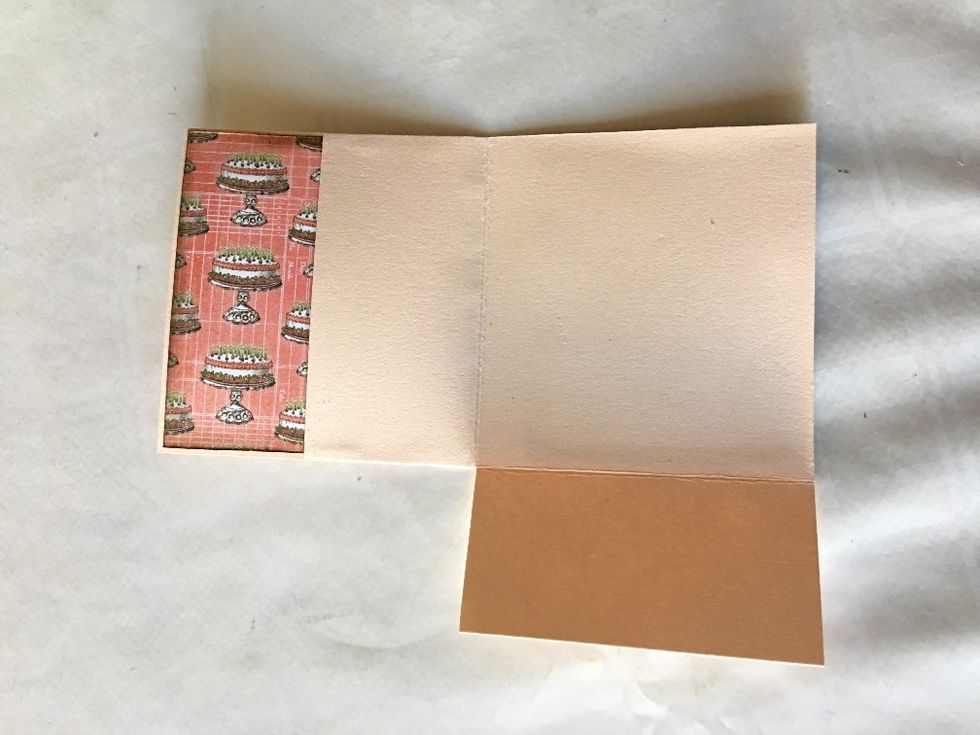 Align the right edge of the inside front cover piece with the folded edge of the flap, and attach the flap to the inside front cover, creating a pocket, as shown.