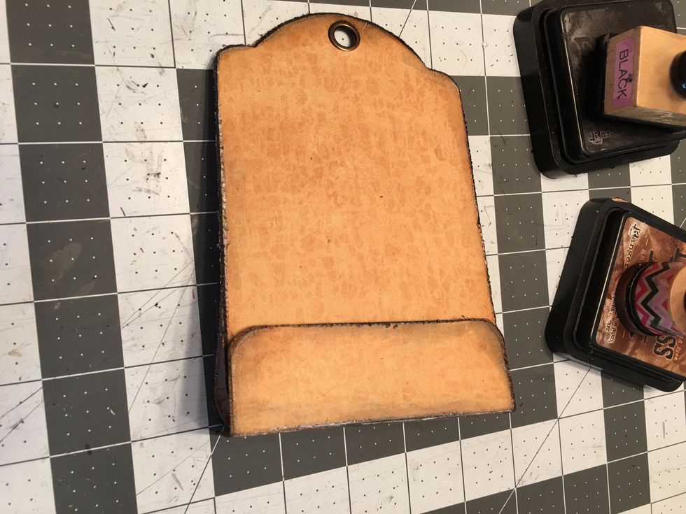 All four magnet snaps are now in place and the back tag wraps around to the front tag and closes.