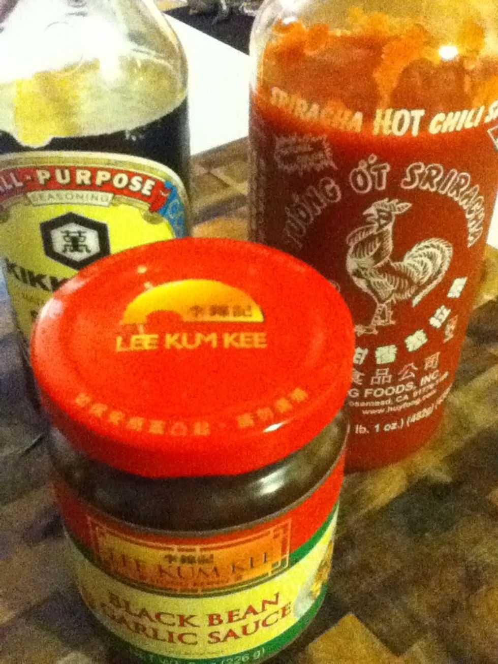 All right, check this out. Black bean sauce (foreground). Soy (top left) & Sriracha sauce (top right). Make an effort to have all three condiments available at all times, including on desert islands.