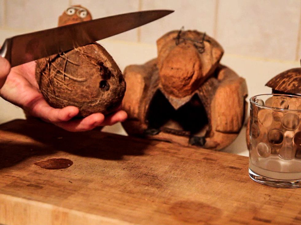 All right..heres the trick. using the BACKSIDE of your knife. (Very important that you DO NOT USE the sharp side of your knife) Give the coconut a good firm smack right in the middle.