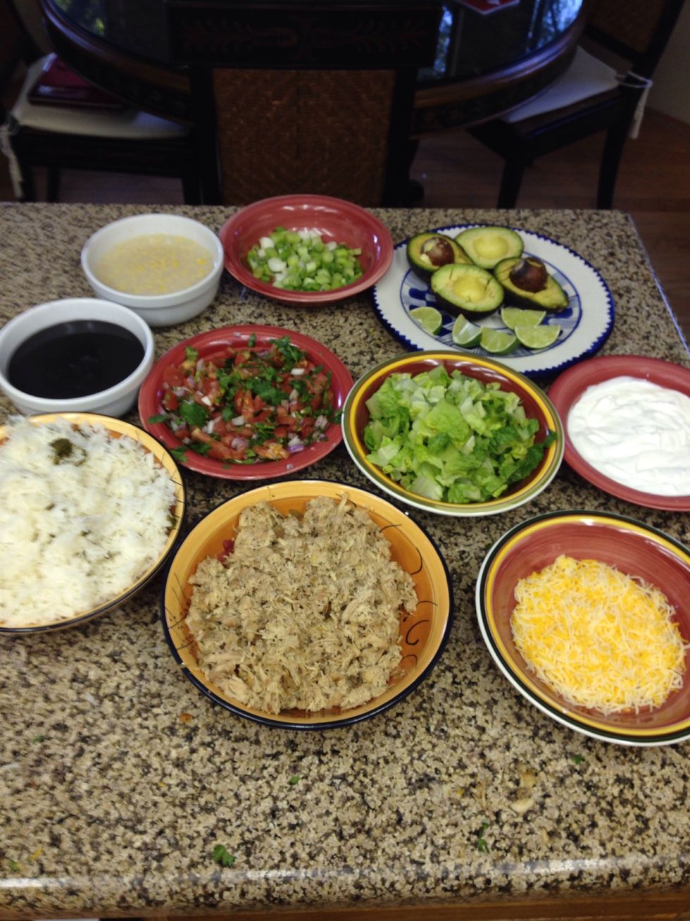 All the condiments. Layer all the ingredients in the taco bowl shells and enjoy :-)