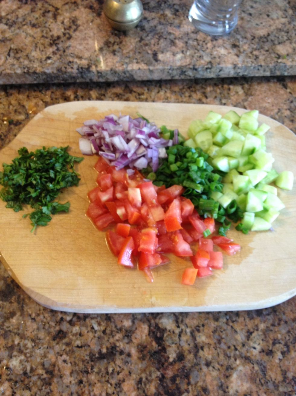 All the ingredients chopped. Cilantro, red and green onions, tomato, and cucumber