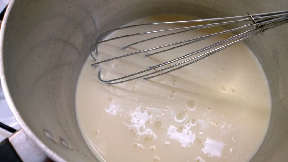 All the ingredients (except the vanilla) in the pot. Stir around and around, clockwise and anticlockwise, whatever you do just don't stop! Don't blame me if you make scrambled eggs.