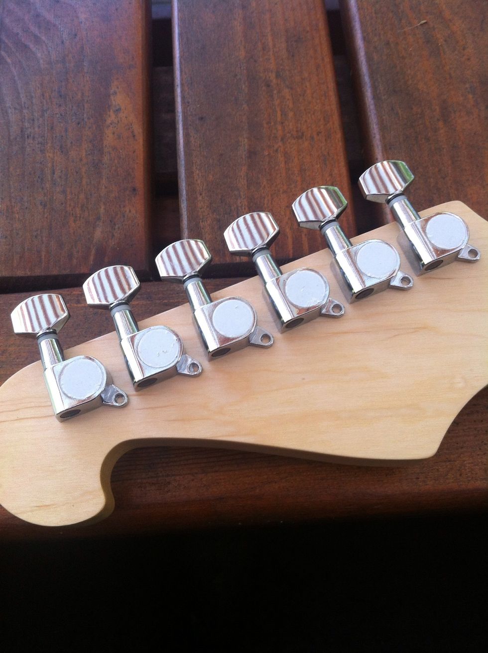 All the tuning keys. Now the small screws left.