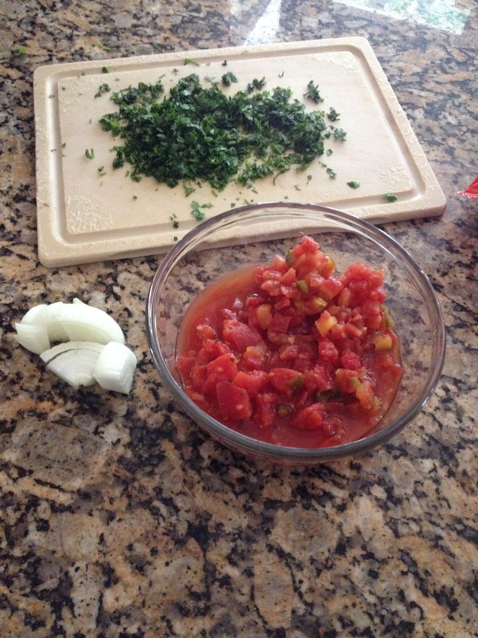 All you will need: fresh, chopped cilantro, half an onion and 1can rotel tomato, and 1 can Mexican style tomatoes