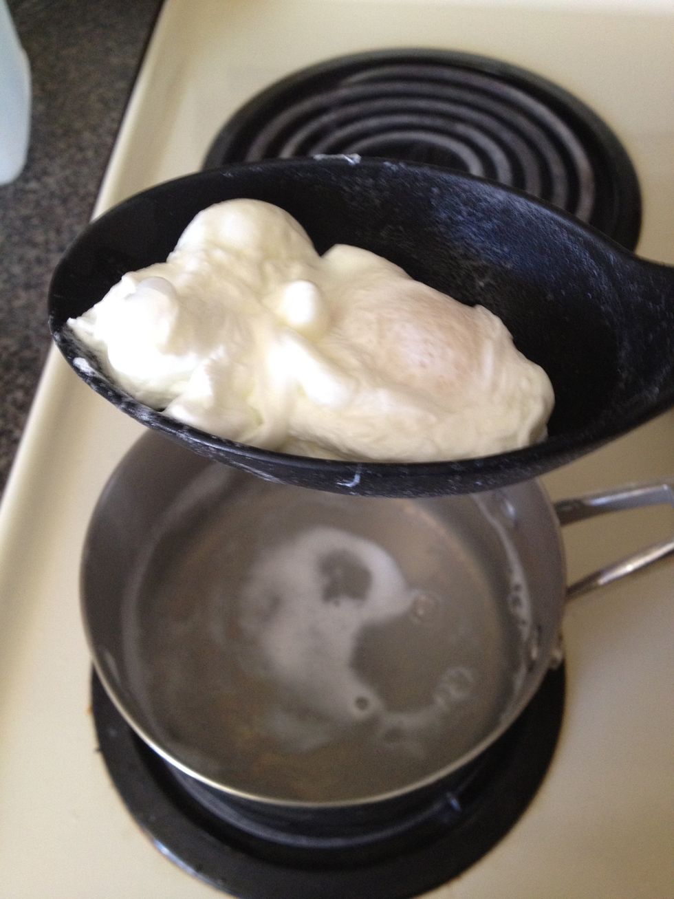 Allow egg to cook for about 3-5mins depending how runny you like your yolk, then remove with a slotted spoon.
