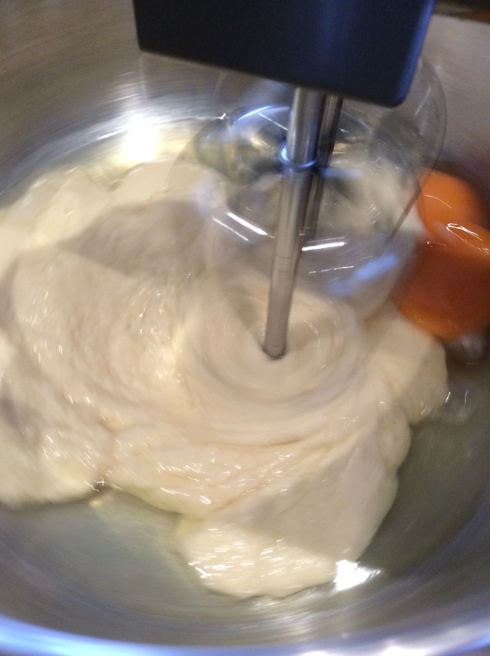 Allow mixture to cool for a couple of minutes. Then beat the eggs with an electric whisk a little at a time until shiny.