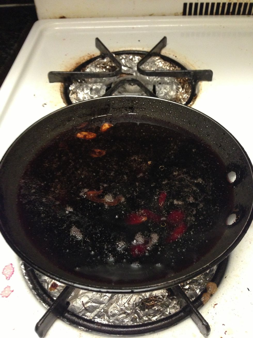 Allow red wine to simmer while you prep and cook the steaks. Do not add green onions yet. Stir occasionally.