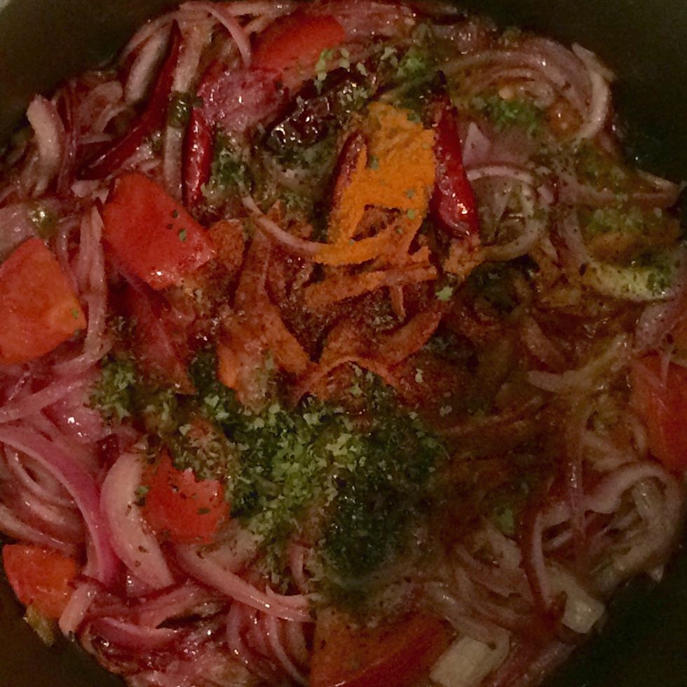 Allow sufficient time for the onions to caramelize. Then add 1 tsp of ground turmeric, 1/2 tsp of cayenne pepper and dried cilantro. Keep mixing.