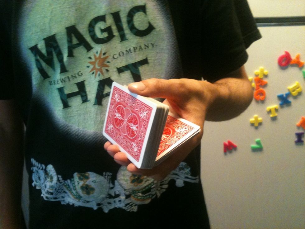 Allow the bottom half of the deck to fall onto your palm. This part will take a little practice. If your hand isn't level the cards can fall off your palm.