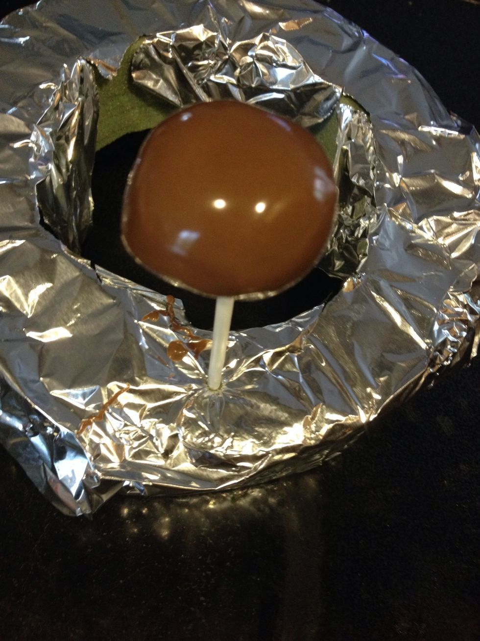 Allow the chocolate to cool for a few minutes and ENJOY : ) (IMPORTANT NOTE: we used a styrofoam ring to place the cake pops so the chocolate will evenly coat the cake pop)