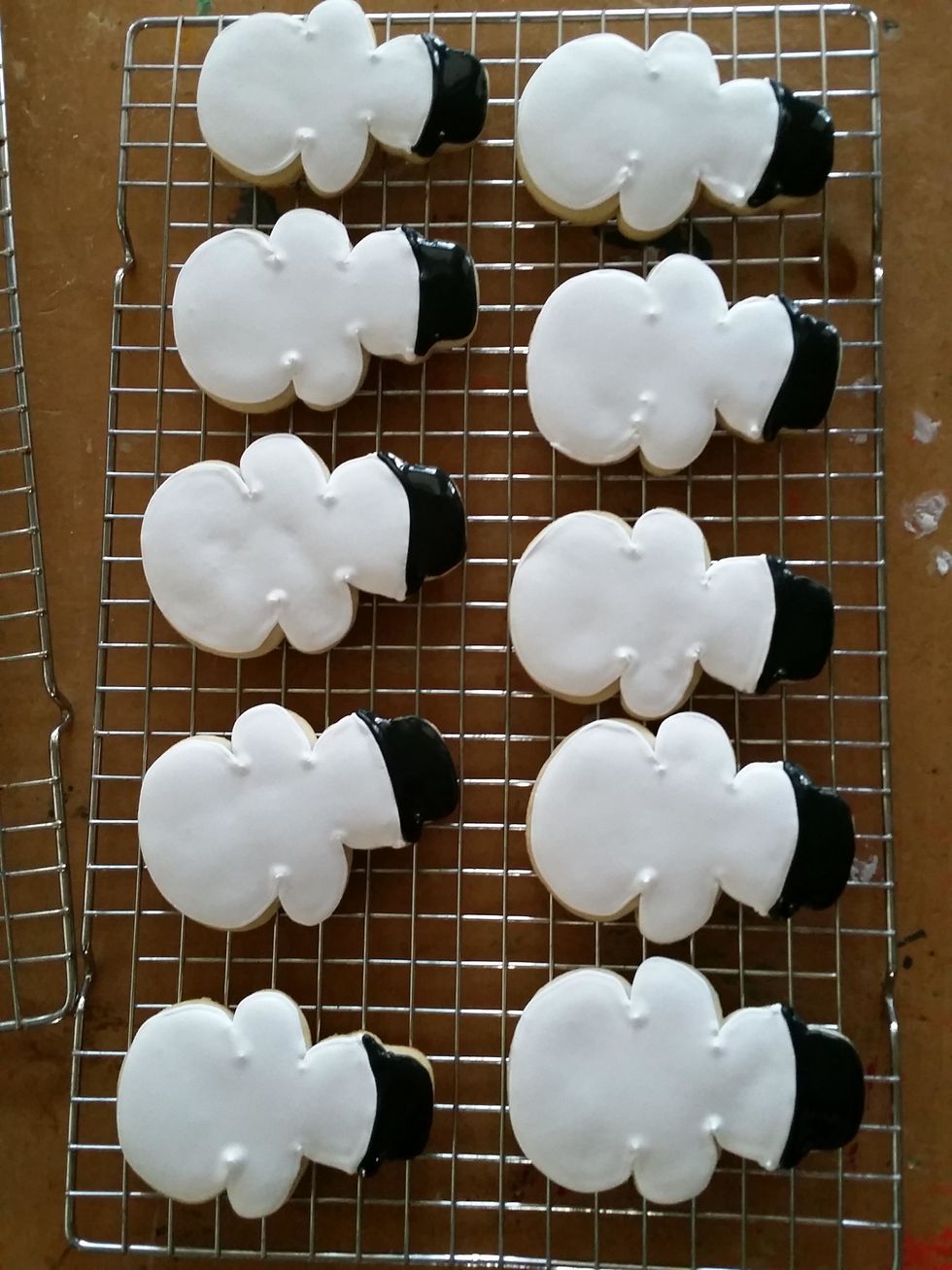 Allow the flooded royal icing cookies to dry completely before assembling the tops. Move on and assemble the bottom portion while drying.