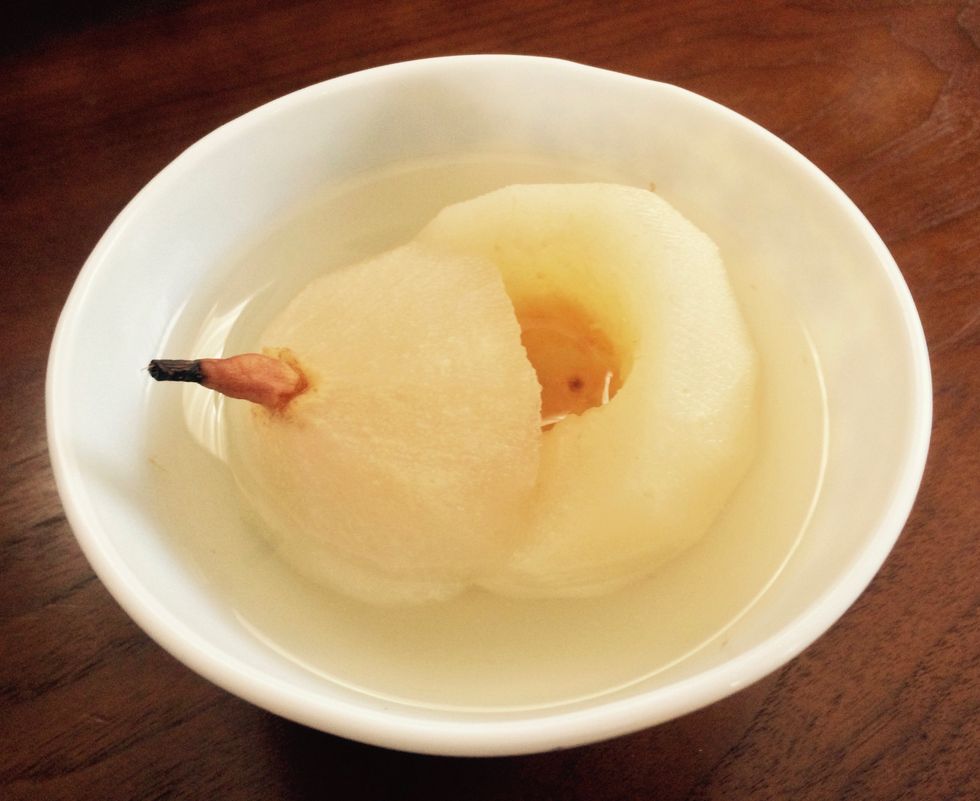 Allow to cool slightly (dish should be eaten warm). Carefully remove the cup/mug (the cup/mug and pear will be hot!), or carefully transfer the pear and juice to a cup/bowl and enjoy.