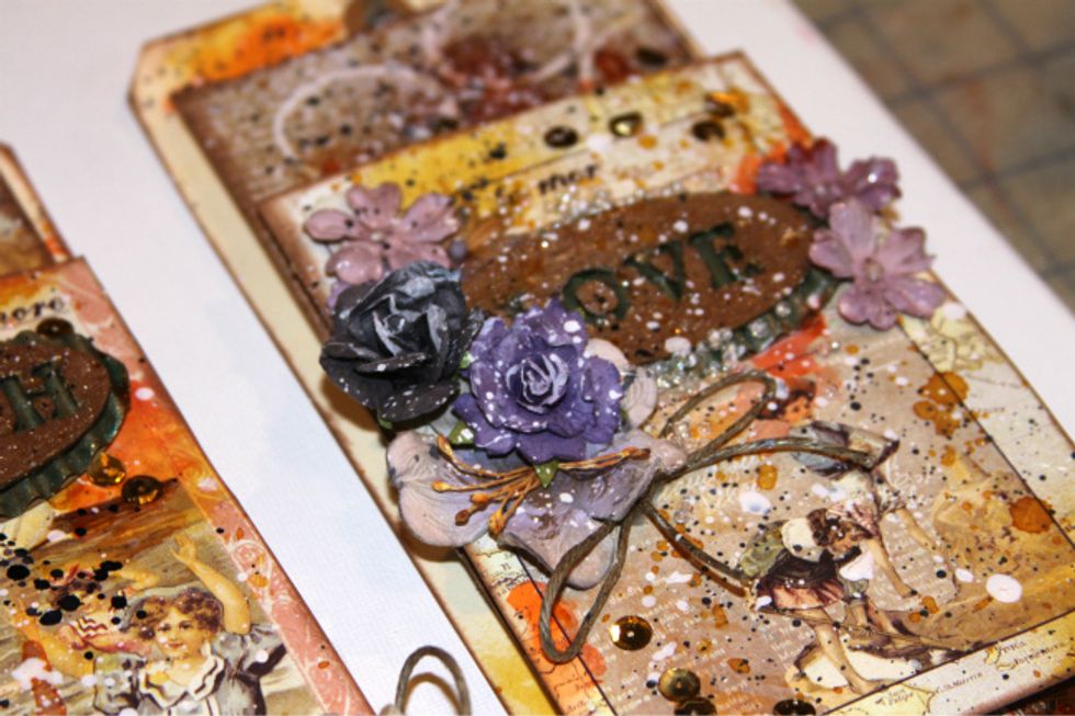 Allow to dry and go over both pieces with Sorbet Gold Digger. Dry Adhere together and adhere to tags. Embellish tags and add splatters