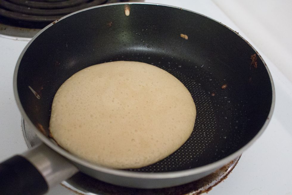Allow to heat up, when the edges brown a little, flip over.