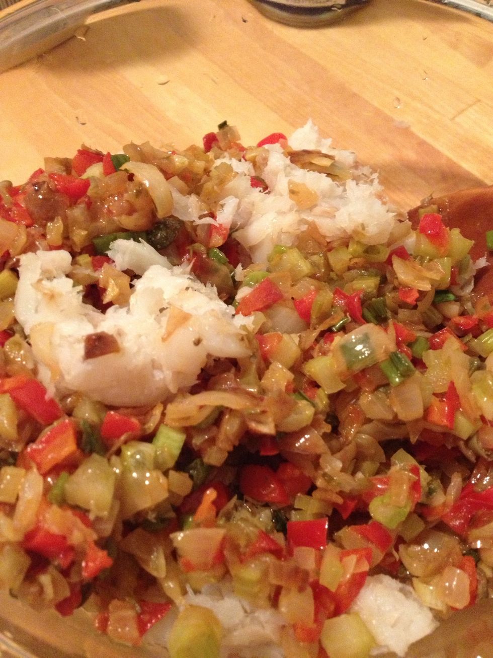 Allow vegetable mixture to cool before handling.  Rinse cod fish, shred as you squeeze excess water through strainer.  Add  fish and cooled vegetable mixture to large bowl.