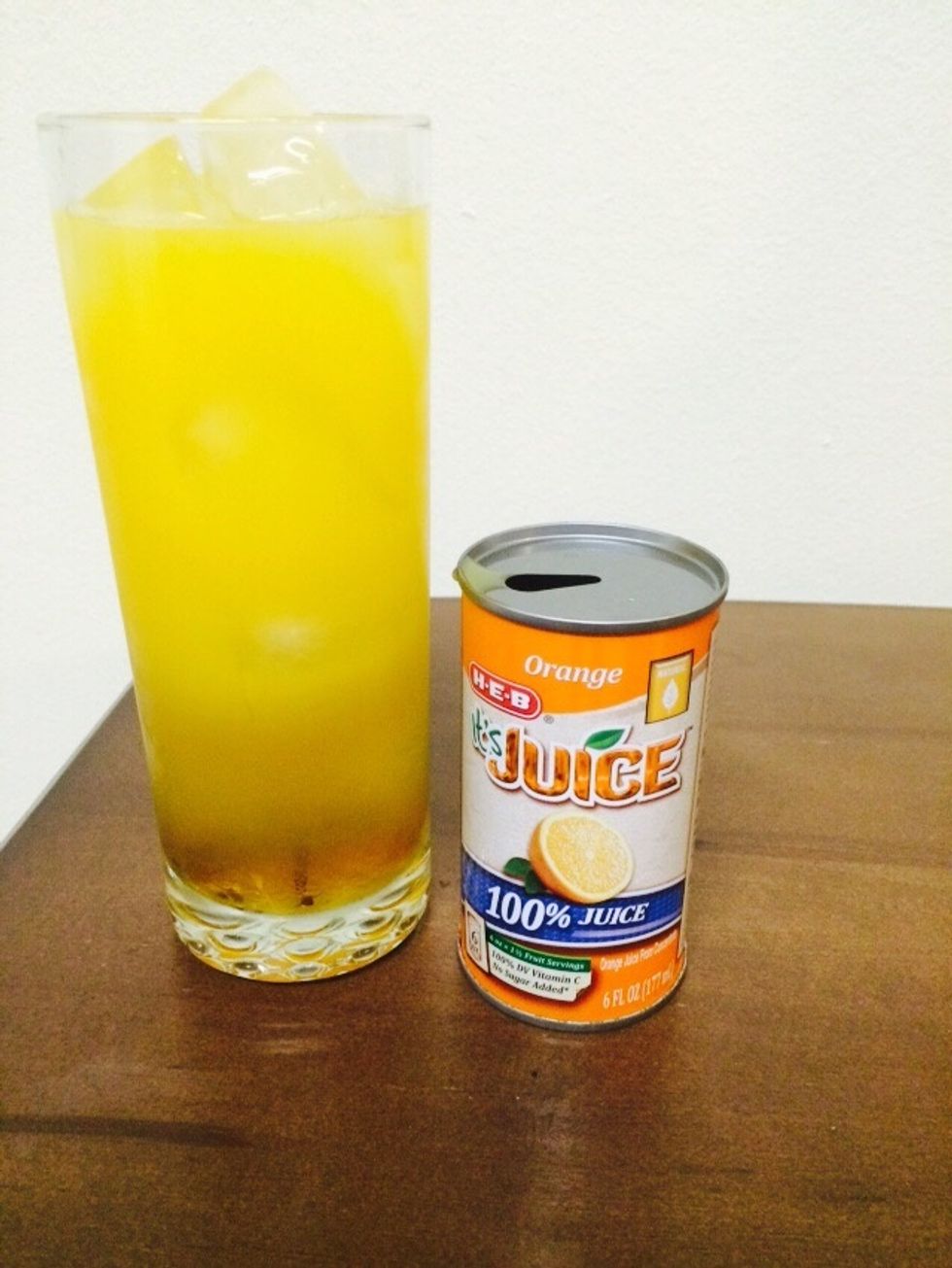 Almost done!!! Add about 4 oz of Orange Juice into the glass.