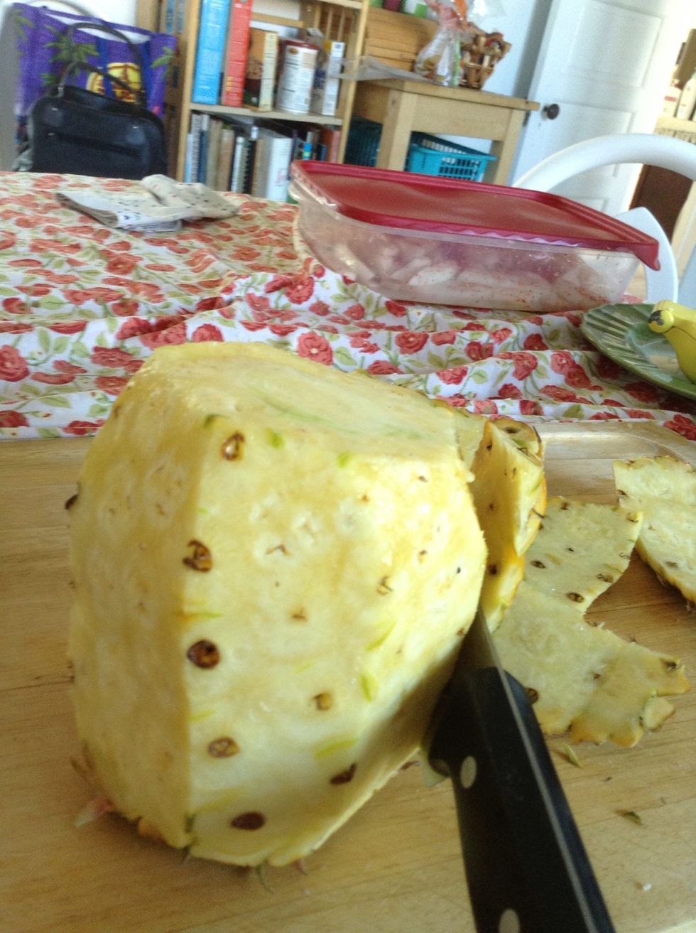 Almost done. Use your knife to cut away some of those brown bits so you're left with pure pineapple.