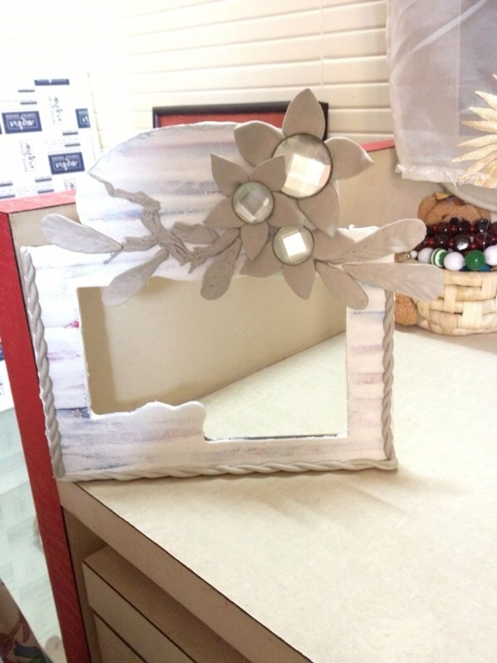 Almost there. I have arranged all the flowers and leaves. I added branches and also added a braid like frame to the edges. Let the creative side in you take over! Now wait for it to dry.\ud83d\ude0a