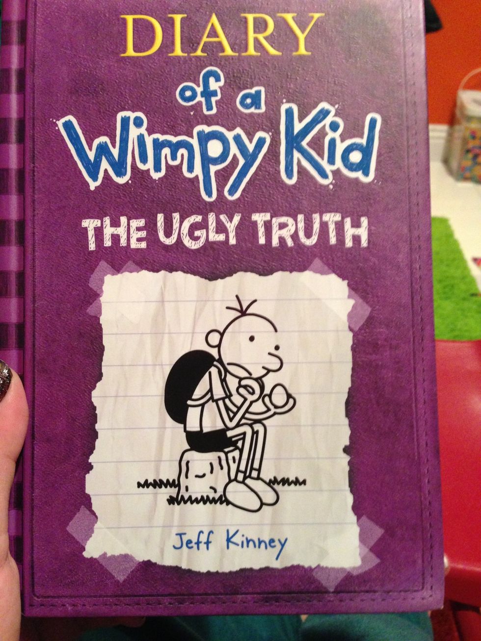 Alot of kids have been reading these! I'm a nanny and my kid has a book report requiring him to make a mask! Greg is the main character and that's who we made the mask of! **Greg is on the cover!