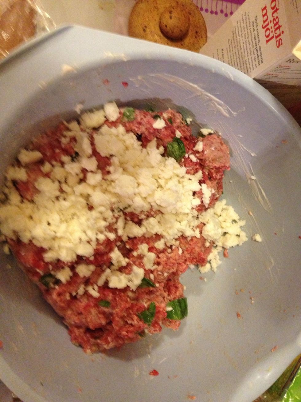 Also add crumbled feta cheese, yogurt, water, black pepper, potato flour and the garlic.