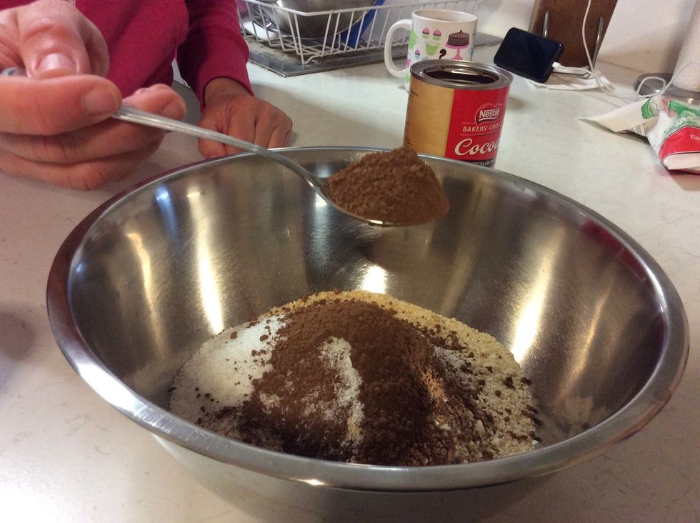 Also, add two table spoons of cocoa powder. Stir the dry ingredients until combined