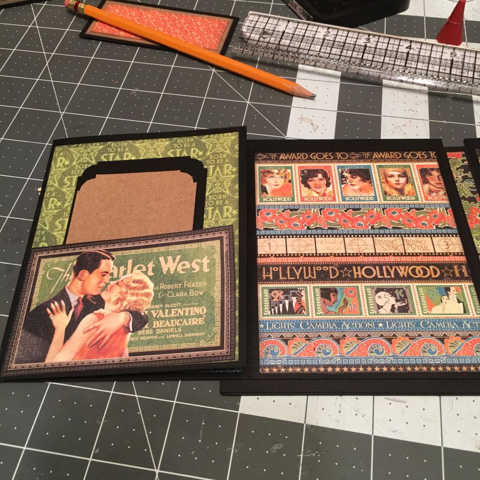 Also cut 2 each 2 1/2" x 3 1/2" photo mats out of black cardstock scraps and decorative punch the corners. Insert into the pockets.