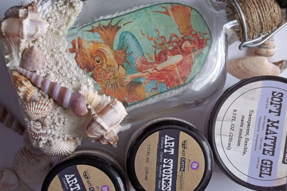 Also glue shells to the bottom of the front of the bottle. Use Soft Matte Gel to add more Art Stones to fill in the textured area, as desired.