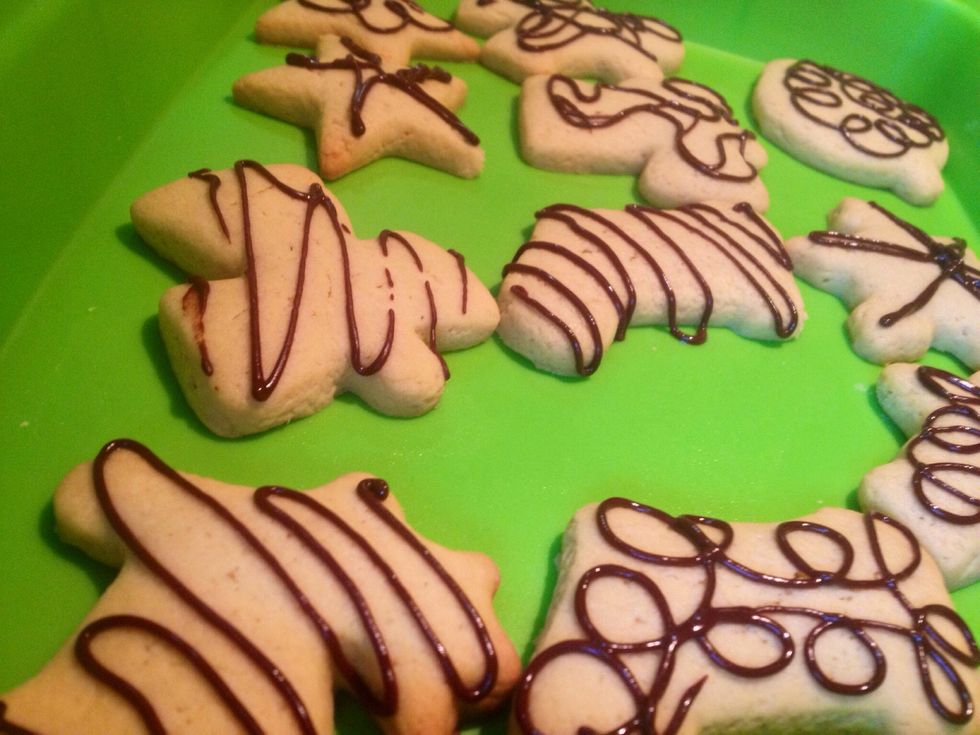 Also, I melt some chocolate with butter and put it in a baking sleeve..and I start making fun and different doodles over the cookies! Have fun!!