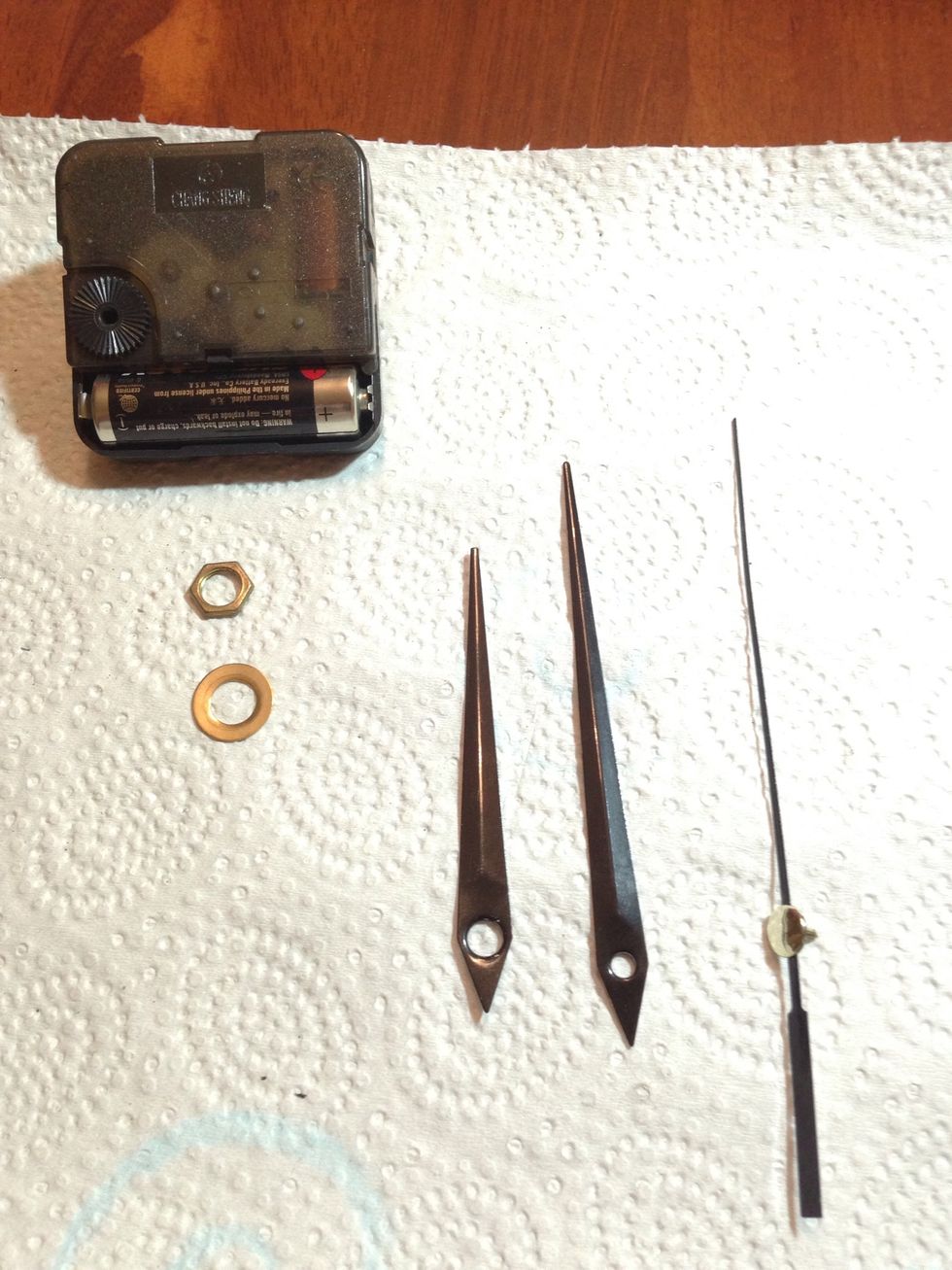 Also, remove the clock mechanism. You may or may not keep the washer and the nut. TIP: depending on the color of the record label, it may be a good idea to repaint the hands. I painted mine red.