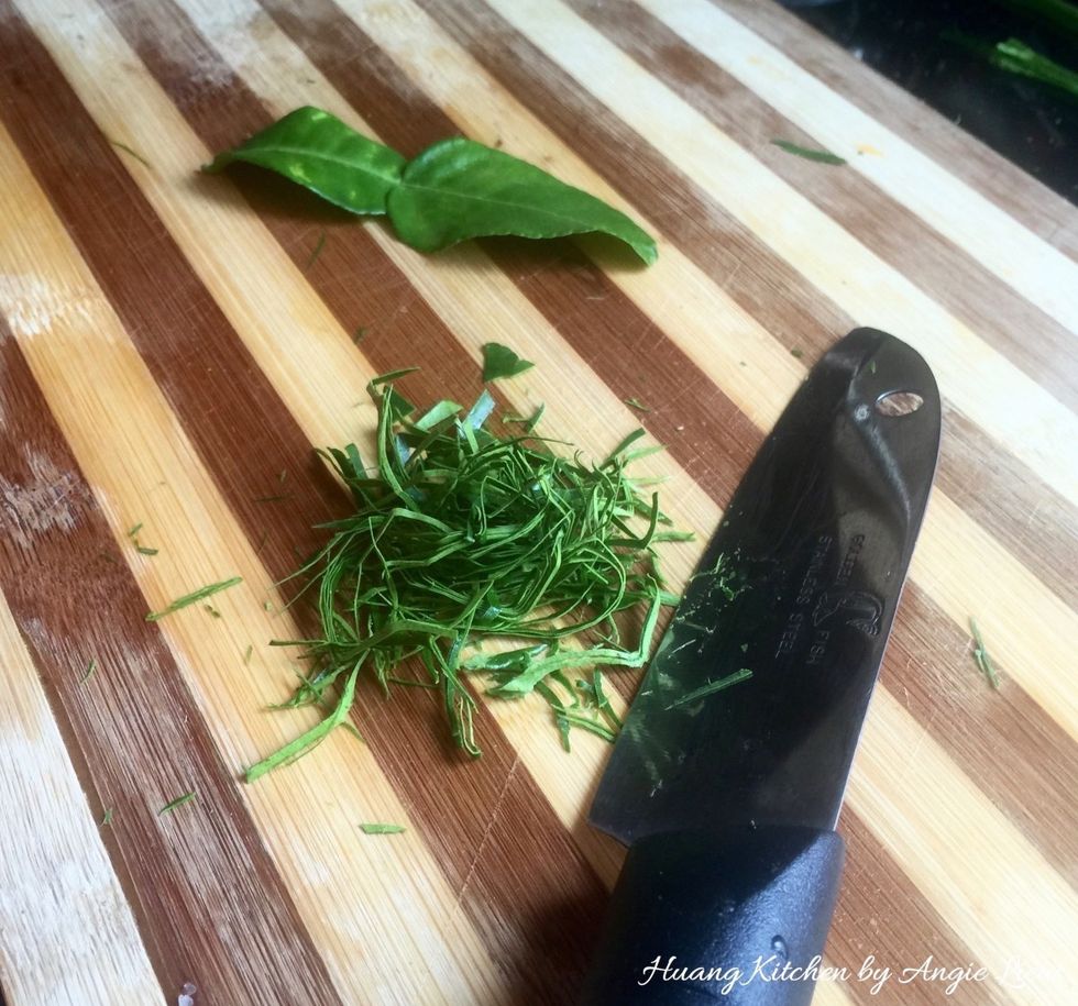 Also, remove the midrib and stalk of young kaffir leaves. Roll together and slice thinly using a sharp knife. Set aside for later use.