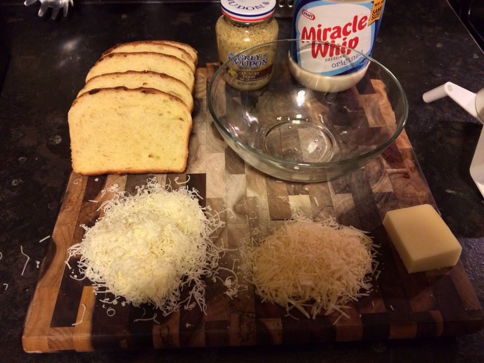 Also shred 1/4 cup Parmesan and 1/4 cup asiago. In this picture, gruyere is on the left, and the Parmesan is on the right. Combine the gruyere and asiago cheeses in a bowl.
