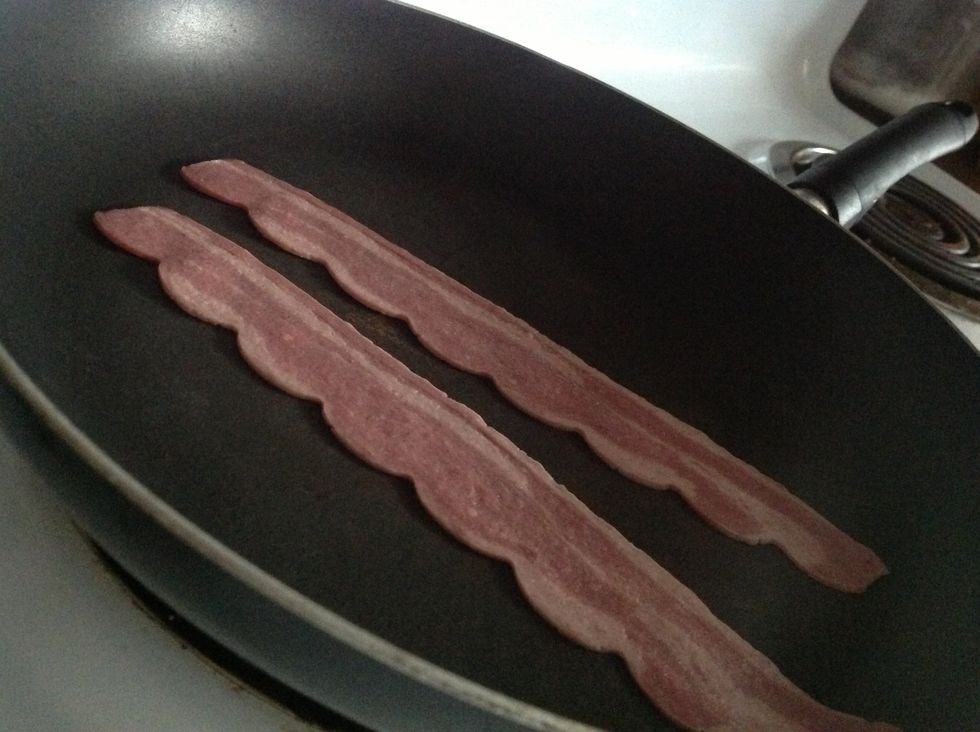 Also while the water boils, place the bacon on the stove. It'll get done cooking by the time you're done poaching. I'm using turkey bacon as a healthier alternative.