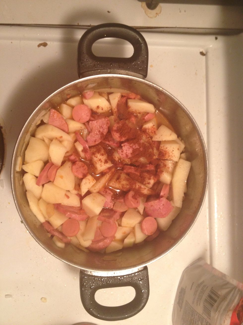 Also while you mix the previous ingredients together add some water its really important as it will add the "sauce" to it. After a few mins when it looks all mixed up add the potatoes and the tomato.