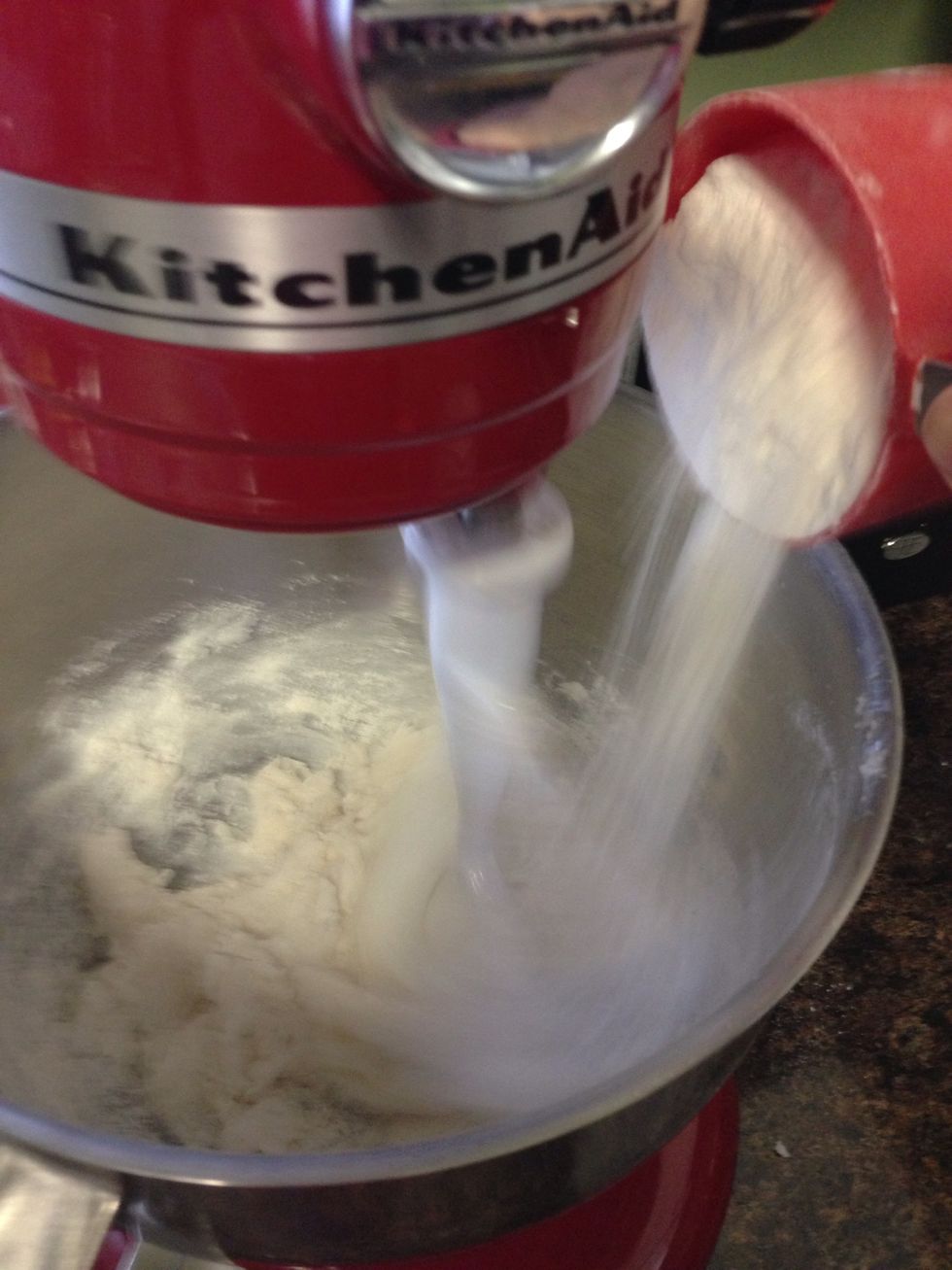 Alternate, adding one third of the flour mixture and one third of the milk to the creamed mixture.