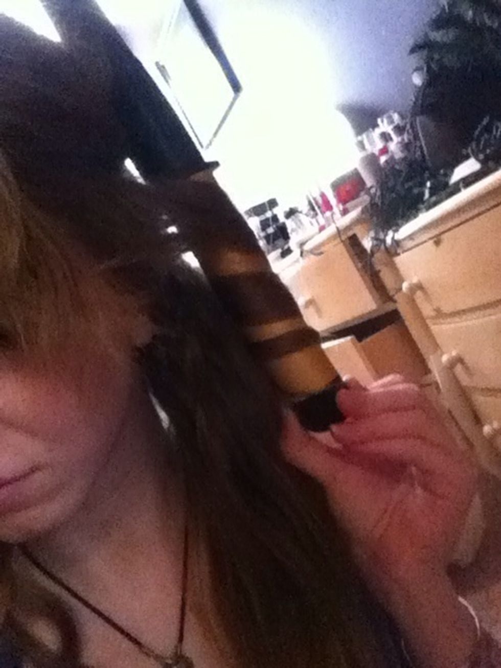 Alternate between curling towards and away from your face. This can be random as long as the very front sections are curled away