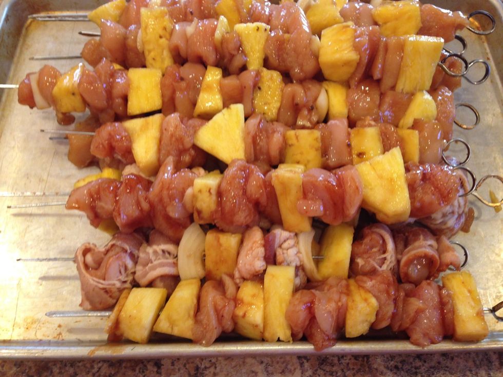 Alternate the onions, chicken, and pineapple. I also wrapped a few pieces of chicken in bacon. It's so yummy!