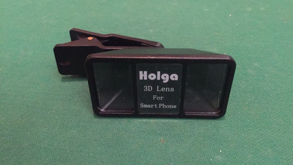 Alternatively you can use the Holga stereoscopic clip on lens. I bought this one on eBay for $44. This method is MUCH easier and requires only one phone and no remote shutter needed.