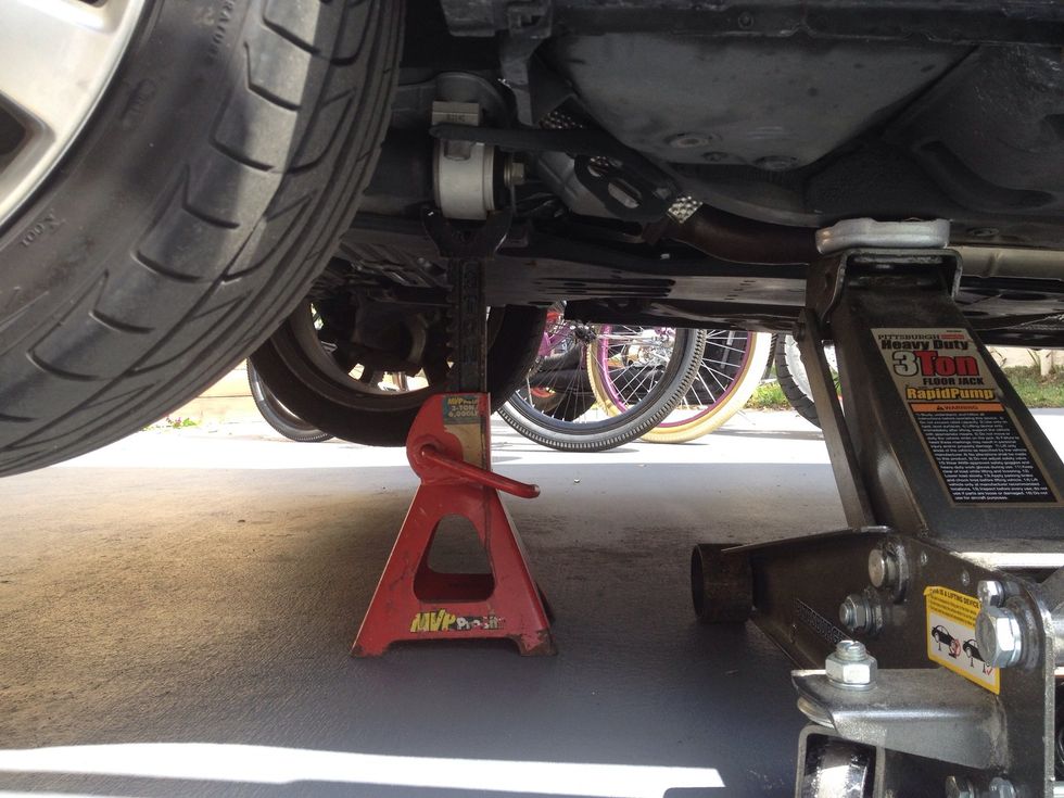 Always always always support the car with a jack stand, don't trust just a jack.