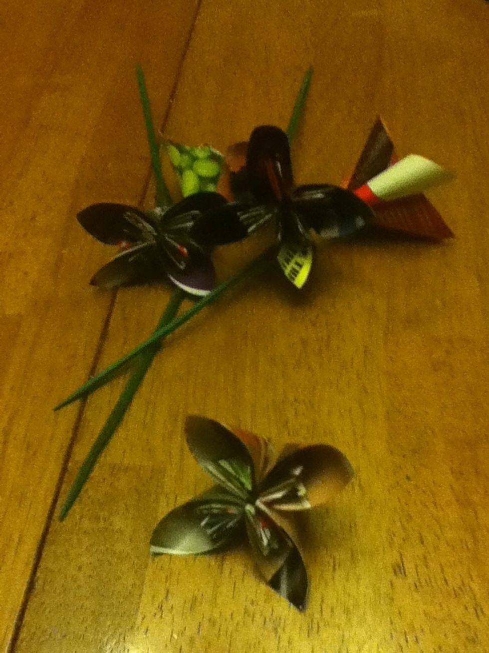 Amy's guide was how to make an origami bouquet for mothers day. I used green wooden florist sticks for the stem and for the flower I used magazine pages. Also green florist tape.