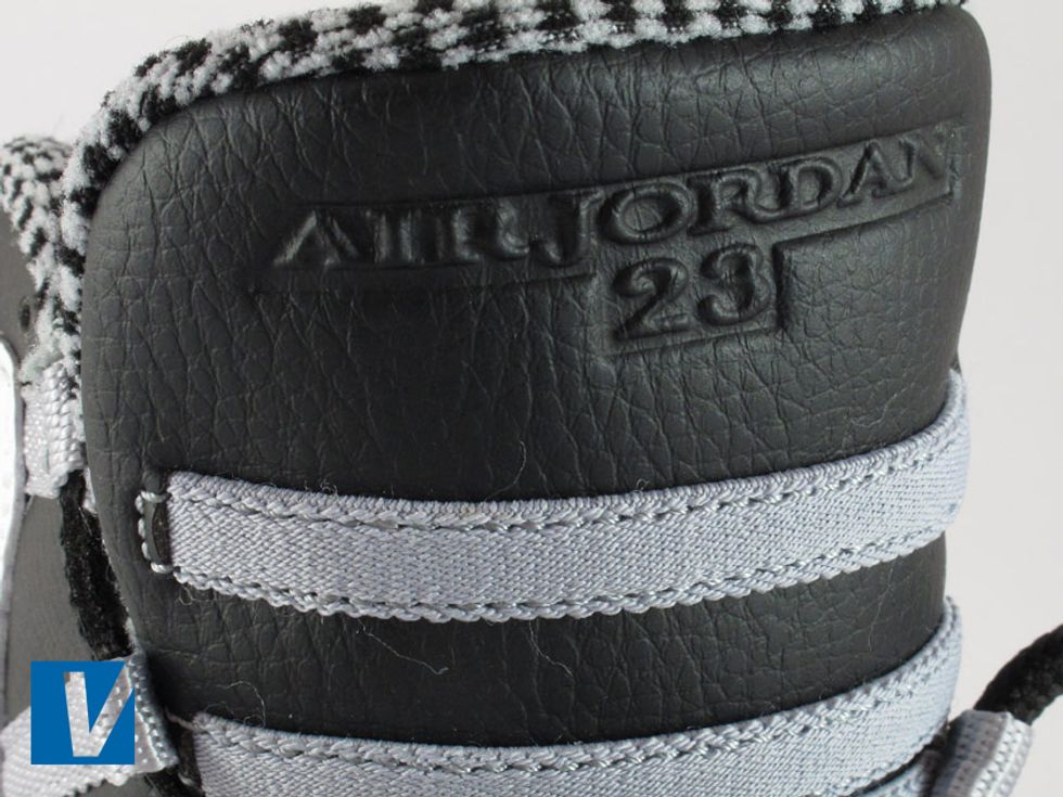 An Air Jordan 23 logo is embossed into the top of the tongue, check that the embossing stands out well and that the letters are clear with sharp edges.