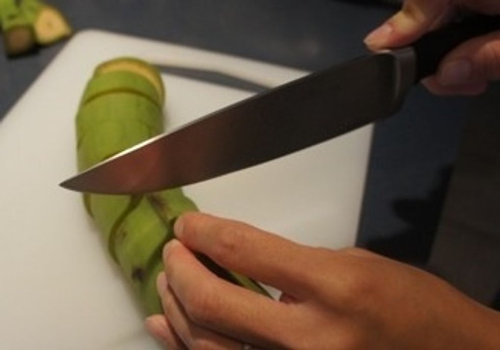 An easier method (I think) is to first cut the plantain in pieces and then remove the skin by slicing it lengthwise and then just peel off.