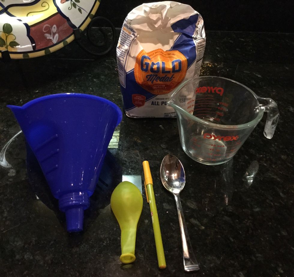 An optional way to make a stress ball is to use flour. The materials you will need are balloons, 1/2 cup of flour, a pen, funnel, and a spoon.