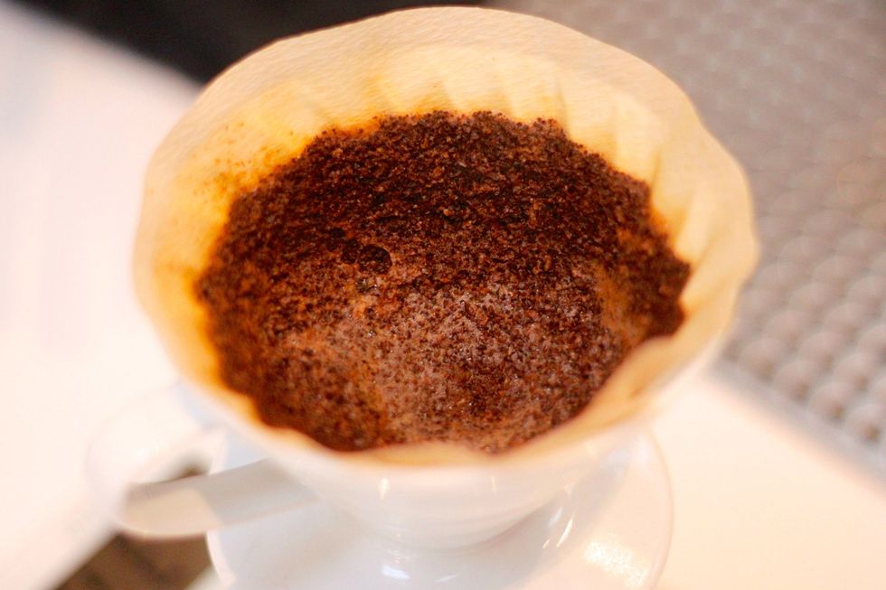 An uneven pour will result in a ton of beans sticking to the sides of the filter. That's a whole lot of wasted flavor!