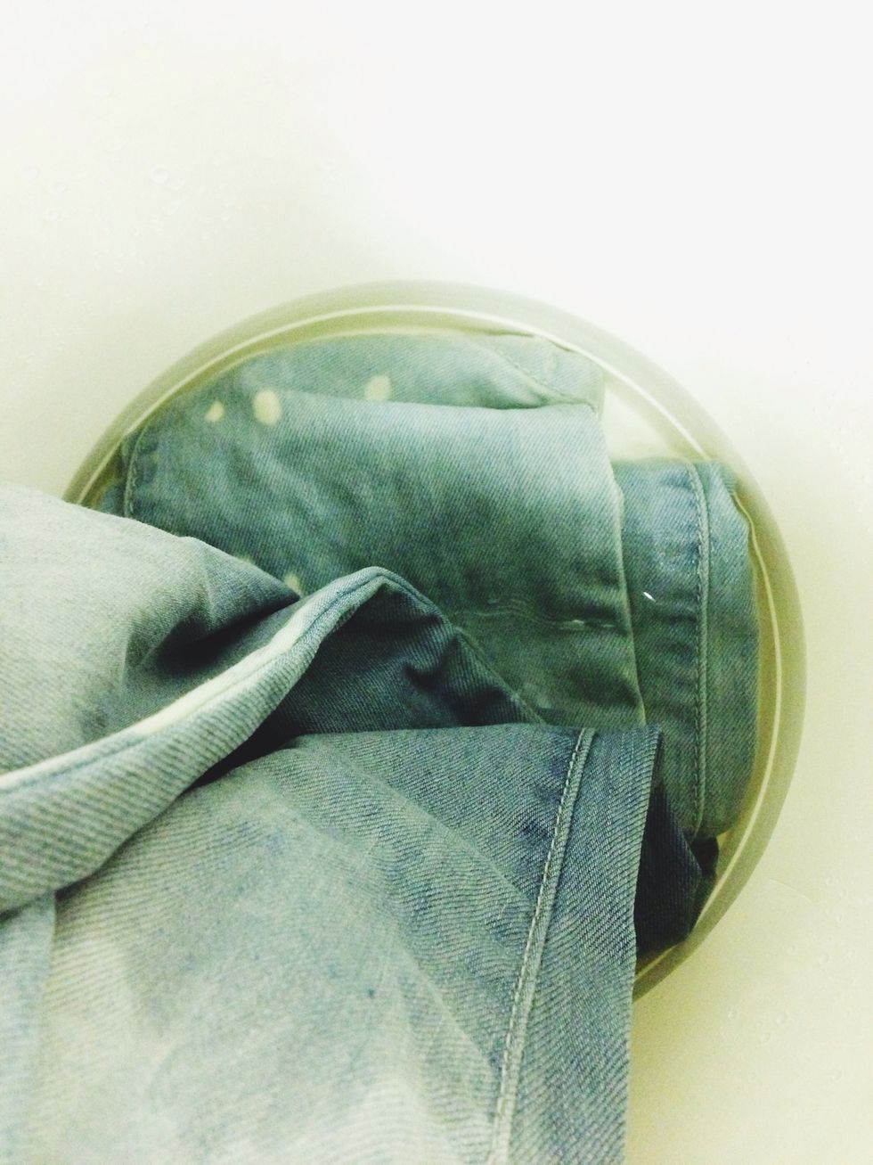 And 20 minutes later, I began round three with even MORE bleach and LESS water. On subsequent rounds, I allowed less of the jeans to make contact with the water, to create a gradual fade.