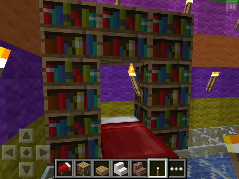 And a bed with a bookshelf bed-head