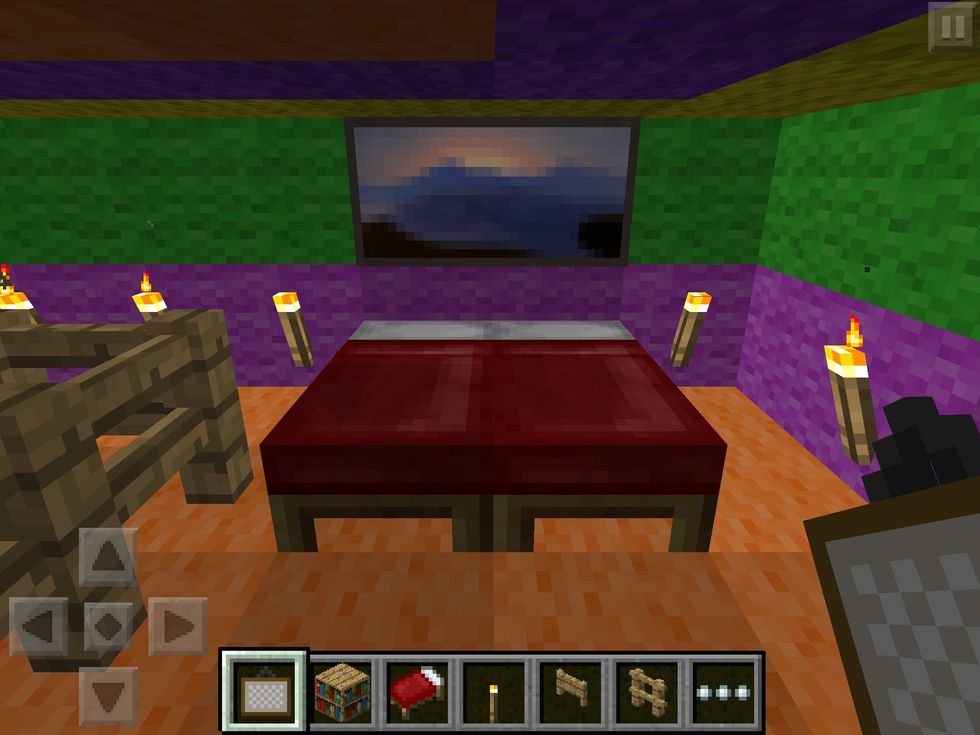 And a bed with a painting