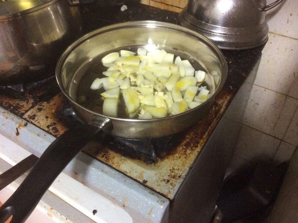 And add the garlic quickly to the onions