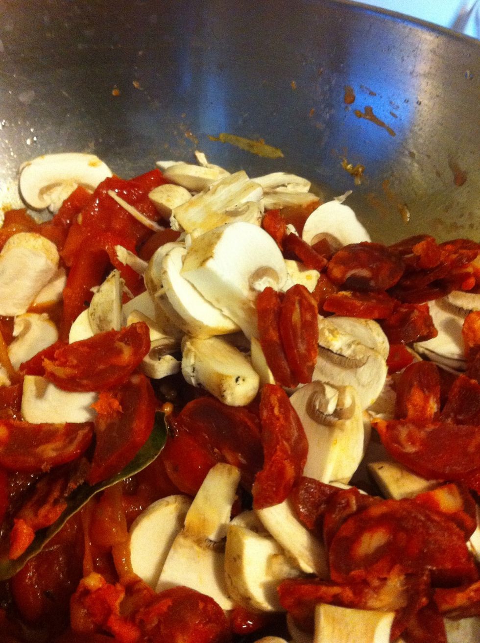 And add this and your chorizo to the pan. If you are using chicken, it really needs to be seared or cooked before it goes in at this point.